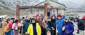 Group in winter gear at Kedarnath temple