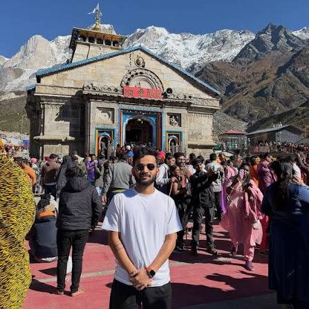 Traveler at Kedarnath temple courtyard